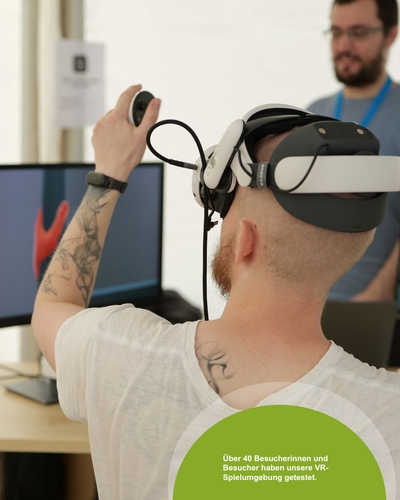 A man is seen from behind wearing a VR headset and holding a controller, which he is raising in his hand.